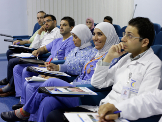 Jordan health care workers sitting in a row 