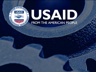 Picture of gears representing the interconnected parts of a health system, plus USAID logo