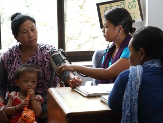 Healthworker provides care to woman in Nepal