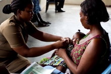 A nurse vaccinates a child at a clinic in Accra, Ghana. 