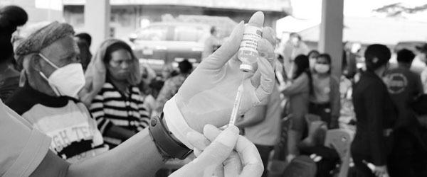 Medical team preparing vaccine injection